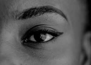 grayscale photo of persons eyes
